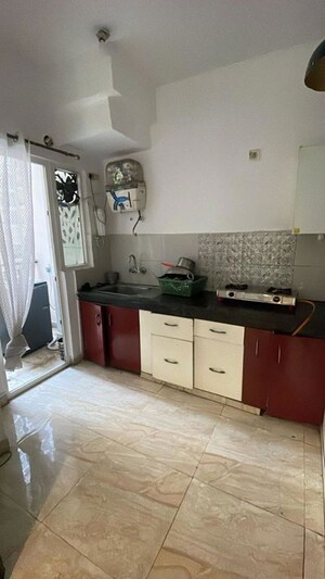 Kitchen in 2 BHK Apartment at Town Park White Orchid, Sector 16c Greater Noida – for Rent