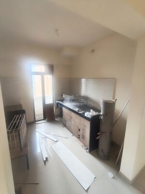 Kitchen in 2 BHK Apartment at Pushpanjali Heights, Owale – for Rent