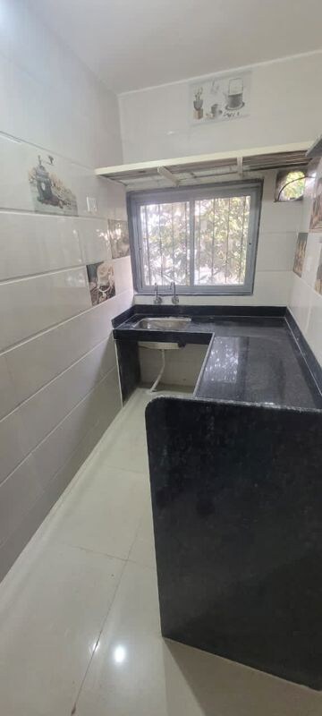 Kitchen in 2 BHK Apartment at Yashodanandan Apartment, Viman Nagar – for Rent