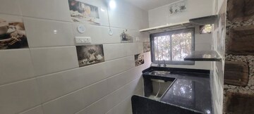 Kitchen in 2 BHK Apartment at Yashodanandan Apartment, Viman Nagar – for Rent