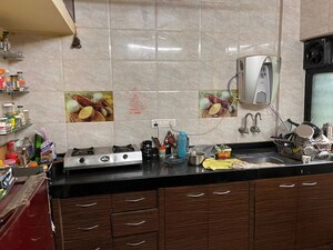 Kitchen in 2 BHK Apartment at Ganga Puram CHS, Viman Nagar – for Rent