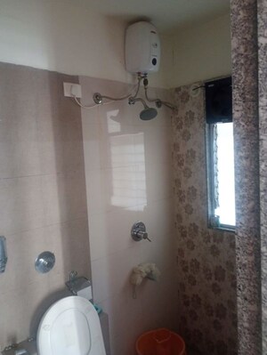 Bathroom in 2 BHK Apartment at Axis Paradigm Whistling Meadows, Paud Road – for Rent