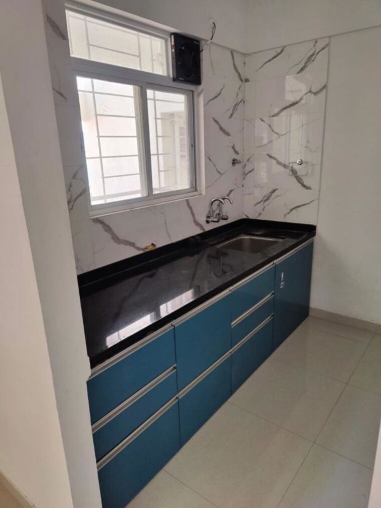 Kitchen, divine-reves 2 Bedroom 725 Sq.Ft. Apartment In Wakad Pune 10060125