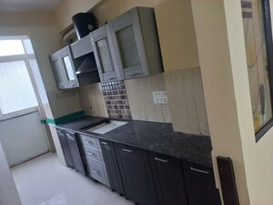 Kitchen in 4 BHK Apartment at Prateek Wisteria, Sector 77 – for Sale