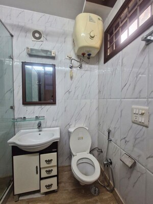 Bathroom in 3 BHK Builder Floor at Kalkaji – for Rent