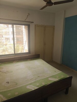 Bedroom in 2 BHK Apartment at Mudit Garden, Kopar Khairane – for Rent