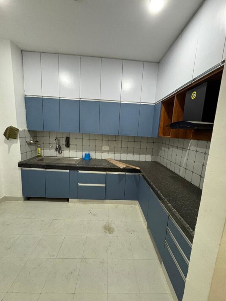 Kitchen, urban-axis-urban-woods 2 Bedroom 697 Sq.Ft. Apartment In Sushant Golf City Lucknow 10063498