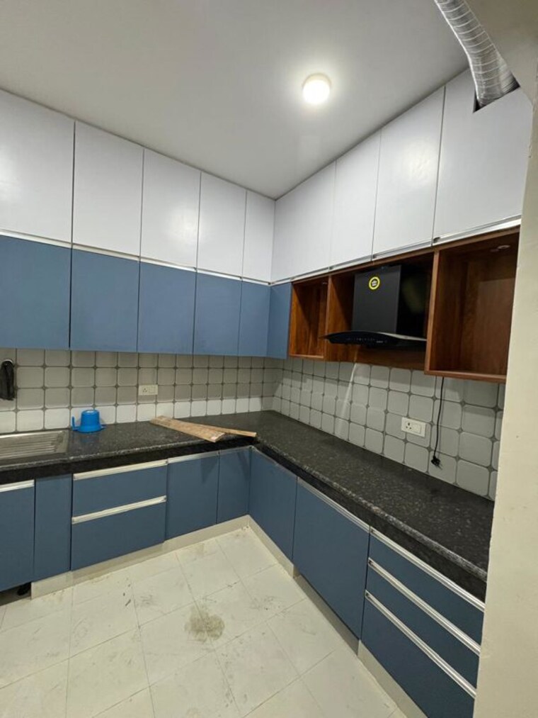 Kitchen, urban-axis-urban-woods 2 Bedroom 697 Sq.Ft. Apartment In Sushant Golf City Lucknow 10063498