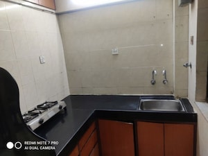 Kitchen in 1 BHK Apartment at Dosti Maitri Gardens, Pokhran Road No Two – for Rent