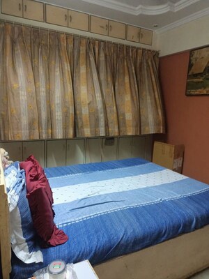 Bedroom in 2 BHK Apartment at Satellite Garden, Goregaon East – for Rent