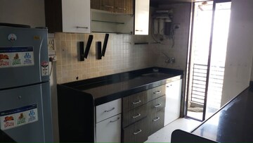 Kitchen in 2 BHK Apartment at Solitaire Heights, Malad West – for Rent