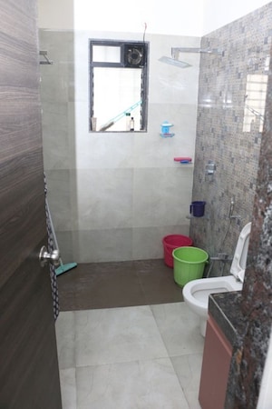 Bathroom in 1.5 BHK Apartment at Dosti Desire, Brahmand – for Sale