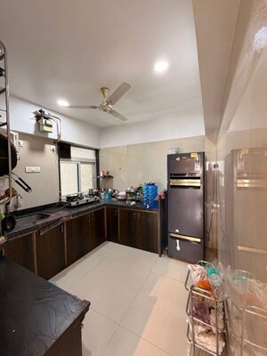 Kitchen in 1 BHK Apartment at Unnati Woods CHS, Kasarvadavali – for Sale