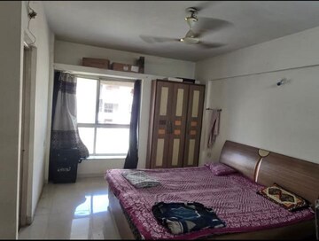 Bedroom in 2 BHK Apartment at Gulmohar Symphony, Kharadi – for Rent
