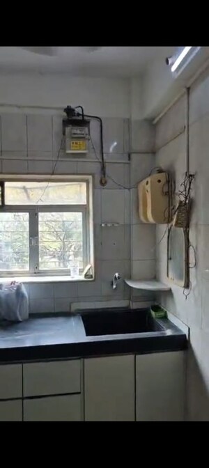 Kitchen in 2 BHK Apartment at Blue Bell CHS Oshiwara, Oshiwara – for Rent