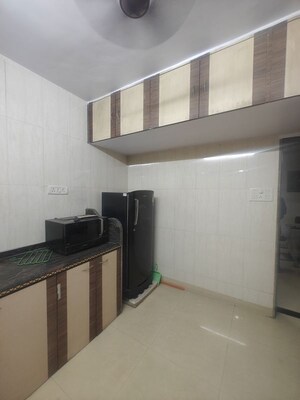 Kitchen in 2 BHK Apartment at Sea Breeze Tower, Nerul – for Rent