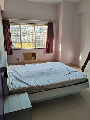 Bedroom in 2 BHK Apartment at NRI Complex Phase I, Seawoods Sector 58 – for Rent