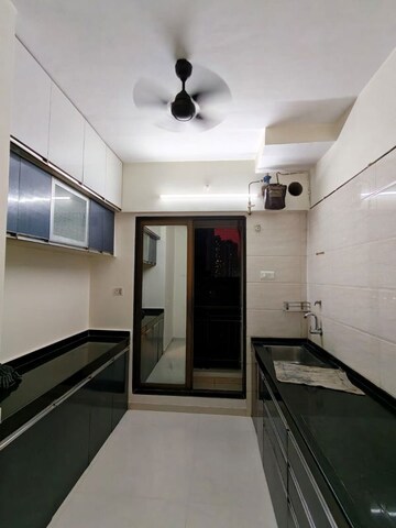 Kitchen in 2 BHK Apartment at Vijay Vatika, Kavesar – for Sale