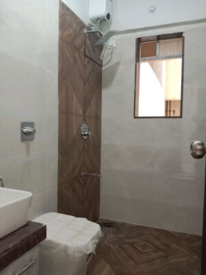Bathroom in 2 BHK Apartment at Shree Tirupati STG Signature Residency, Patlipada – for Rent