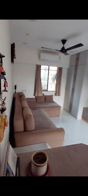 Living Room in 1 BHK Apartment at Sudarsan Panchsheel, Andheri East – for Sale