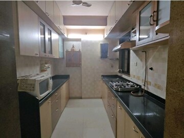 Kitchen in 3 BHK Apartment at Laxmi Raajvilas, Goregaon West – for Rent