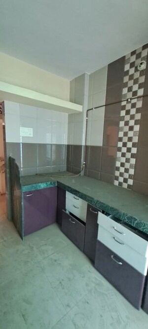 Kitchen in 1.5 BHK Apartment at Yamuna Malhari Ghorpade Arcade, Badlapur East – for Rent