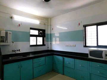 Kitchen in 2 BHK Apartment at Swanashilp Apartment, Karve Nagar – for Rent