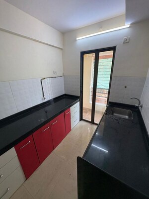 Kitchen in 2 BHK Apartment at Hubtown Greenwoods, Vartak Nagar – for Sale