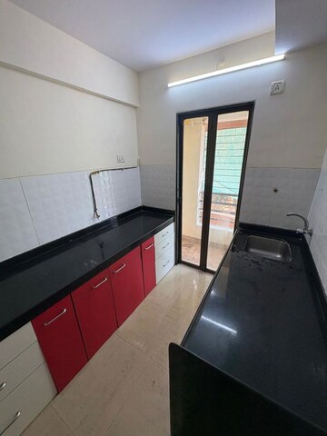 Kitchen in 2 BHK Apartment at Hubtown Greenwoods, Vartak Nagar – for Sale