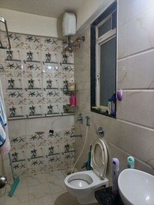 Bathroom in 2 BHK Apartment at Ravinanda Skylights, Wagholi – for Rent