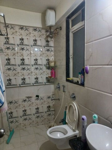 Bathroom in 2 BHK Apartment at Ravinanda Skylights, Wagholi – for Rent