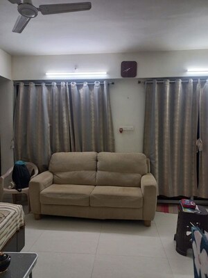 Living Room in 2 BHK Apartment at Ravinanda Skylights, Wagholi – for Rent