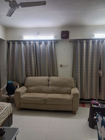 Living Room in 2 BHK Apartment at Ravinanda Skylights, Wagholi – for Rent