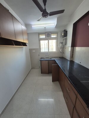 Kitchen in 2 BHK Apartment at Hiranandani Villa Grand, Ghodbunder Road – for Rent