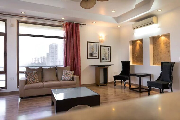 Living Room, jaypee-green-earth-court 4 Bedroom 4400 Sq.Ft. Apartment In Jaypee Greens Greater Noida 10073452