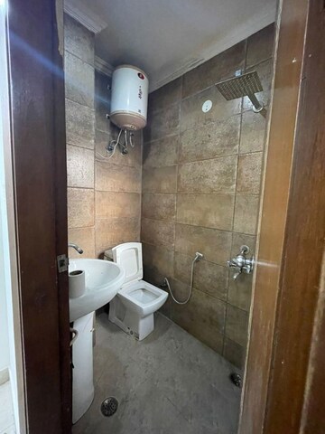 Bathroom in 1.5 BHK Builder Floor at Chattarpur – for Rent