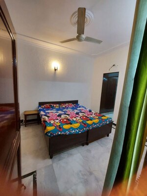 Bedroom in 1.5 BHK Builder Floor at Arun Yamuna Enclave, Sector 30 – for Rent