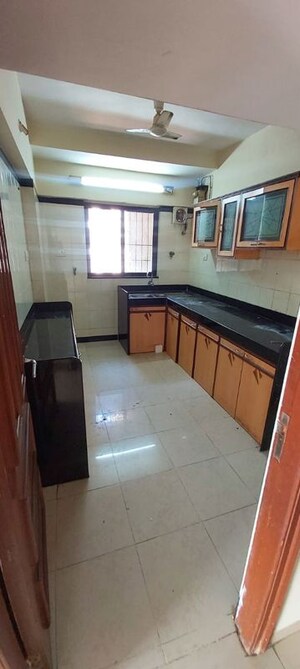 Kitchen in 2 BHK Apartment at Serenity Heights, Malad West – for Rent