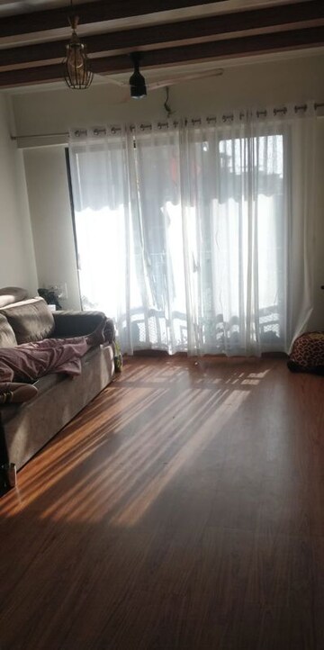 Living Room in 1 BHK Apartment at Rassaz Greens, Mira Road – for Rent