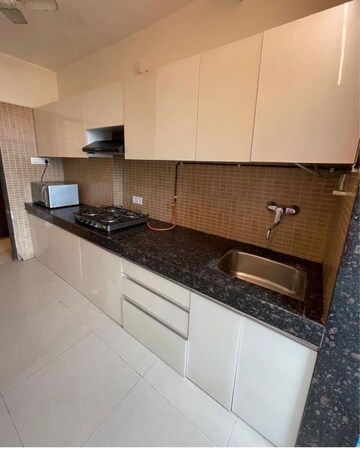 Kitchen in 2 BHK Apartment at Kamanwala Manavsthal, Malad West – for Rent