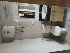 Kitchen in Studio Apartment at Nimbus The Golden Palm, Sector 168 – for Rent