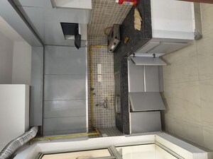 Kitchen in 2.5 BHK Apartment at Nimbus The Golden Palm, Sector 168 – for Rent