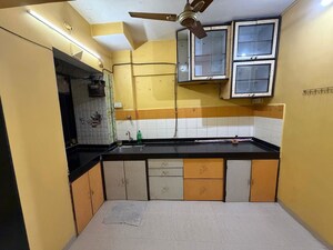 Kitchen in 2 BHK Apartment at Highland Annex, Majiwada – for Rent