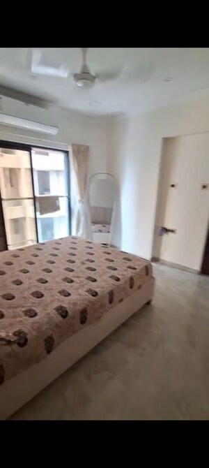 Bedroom in 2 BHK Apartment at Svarna Rosemary, Mahim West – for Rent