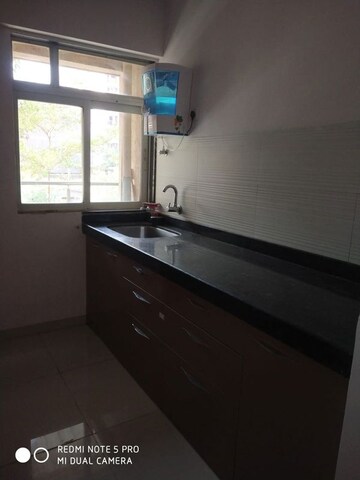 Kitchen in 1 BHK Apartment at Squarefeet Ace Square, Thane West – for Rent
