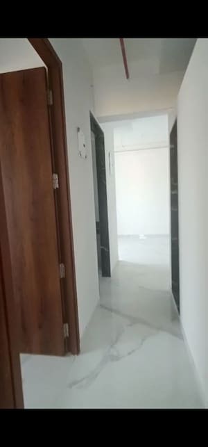 Building Lobby in 2 BHK Apartment at Pramanik Walchand Paradise, Mira Road – for Rent