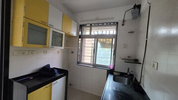 Kitchen in 2 BHK Apartment at Vasant Fiona, Pokhran Road No Two – for Rent