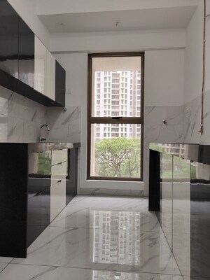 Kitchen in 2 BHK Apartment at Raymond Ten X Habitat, Pokhran Road No Two – for Rent