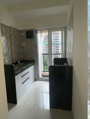 Kitchen in 1 BHK Apartment at Raunak Residency Thane, Pokhran Road No One – for Rent