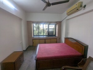 Bedroom in 2 BHK Apartment at Asha Nagar CHS, Mulund West – for Rent